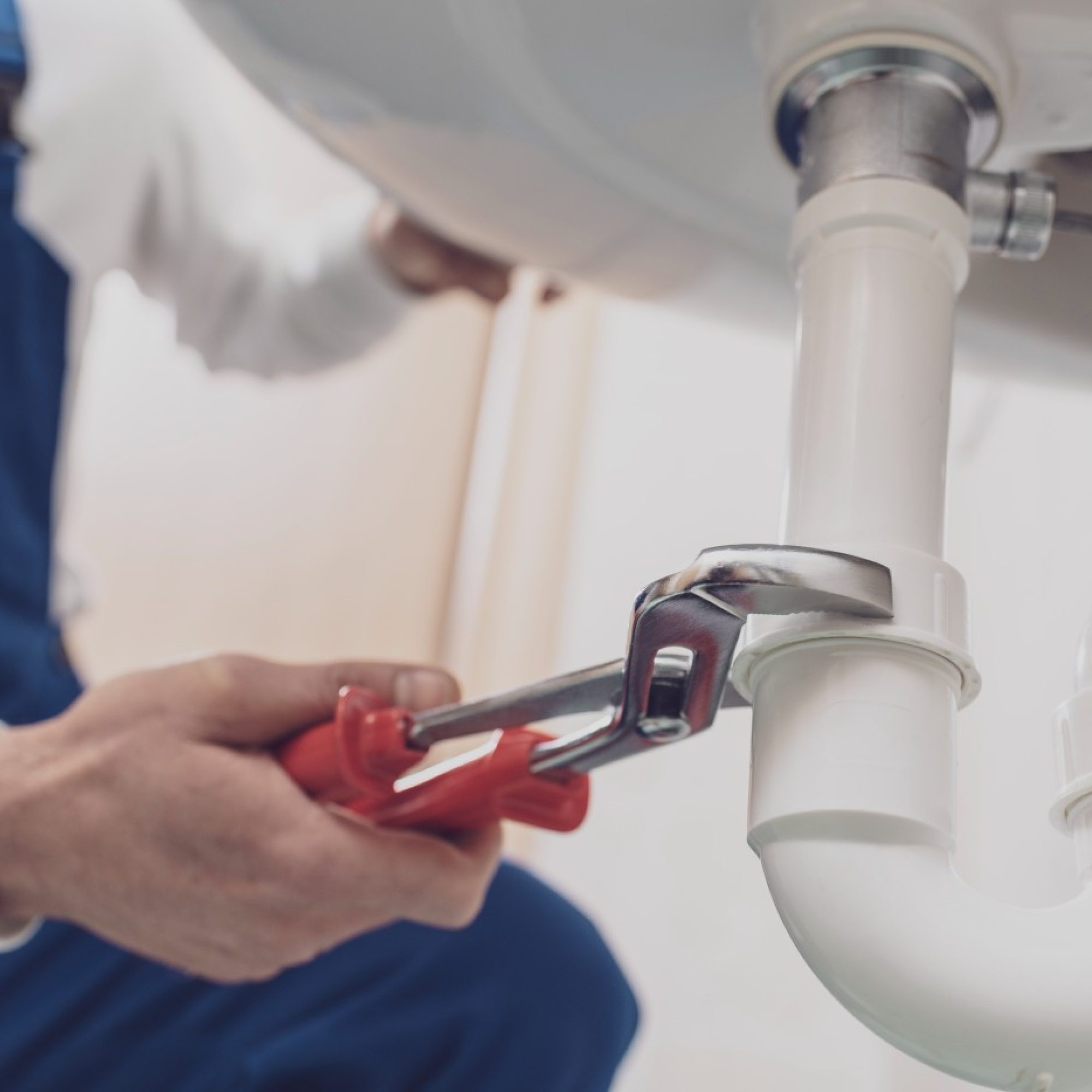 plumber-fixing-a-sink-at-home-2024-10-11-01-14-41-utc-1-1